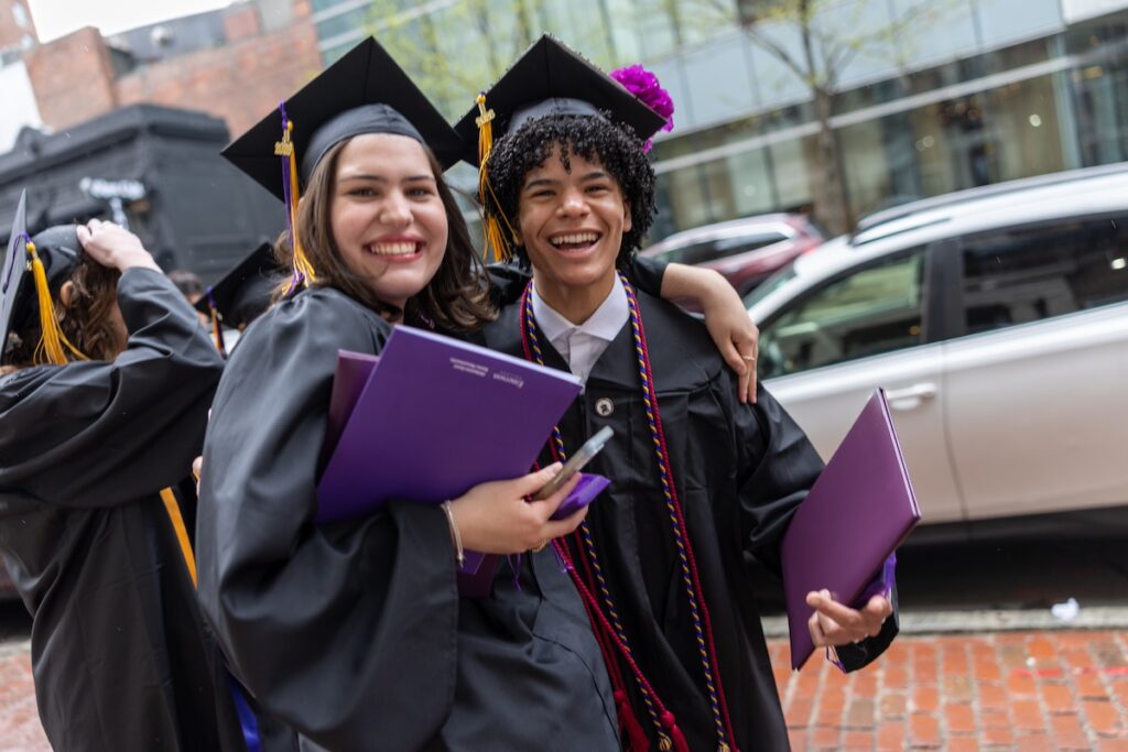 two alums smile after the ceremony