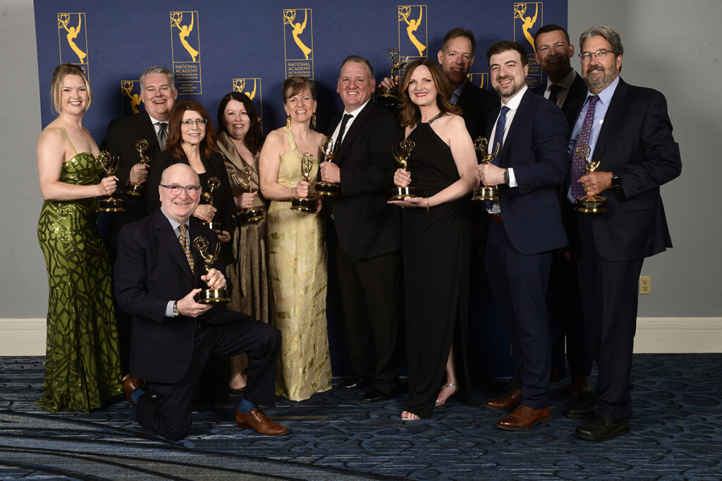 WCVB News team poses with regional Emmys|Sue O'Connell holds an Emmy|