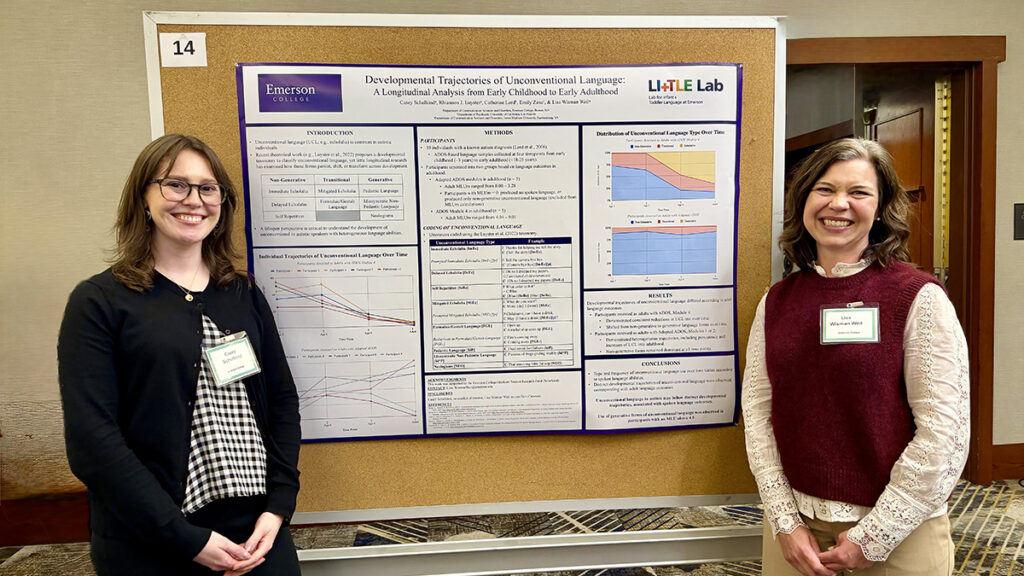 two women stand on either side of a cork board with a research poster pinned to it|Ruth Grossman with grad student
