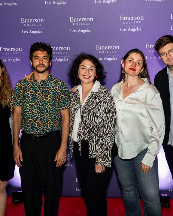 Five filmmakers pose in front of Emerson Los Angeles step and repeat