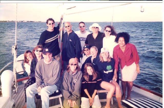 A lot of people on a boat pose for a photo