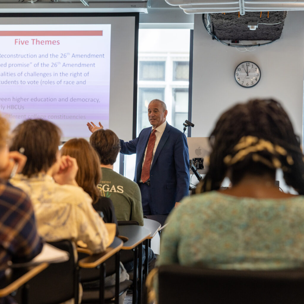 Jonathan Becker talks to a classroom of students
