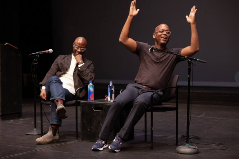 Barry Jenkins and Jewerl Ross speak and gesture on stage