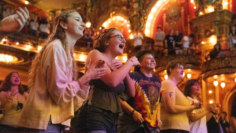 Students cheer inside Cutler Majestic Theatre