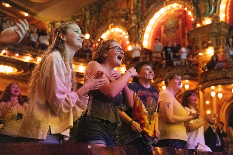 Students cheer inside Cutler Majestic Theatre