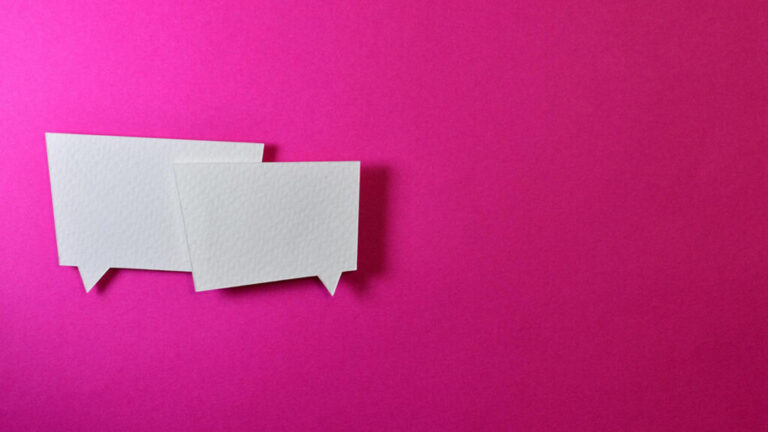 two conversation bubbles against pink background