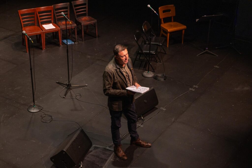 Russell Miller talks on stage