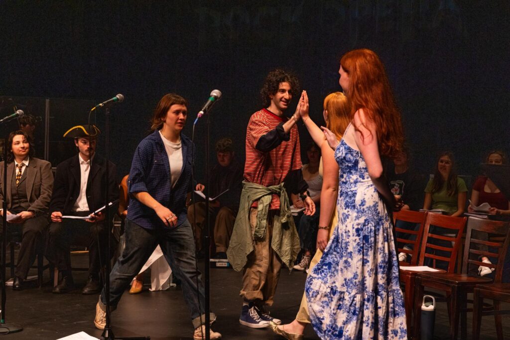 People perform on stage