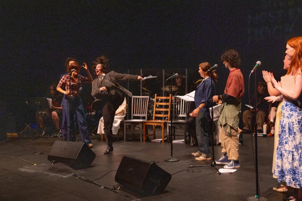 People sing on stage