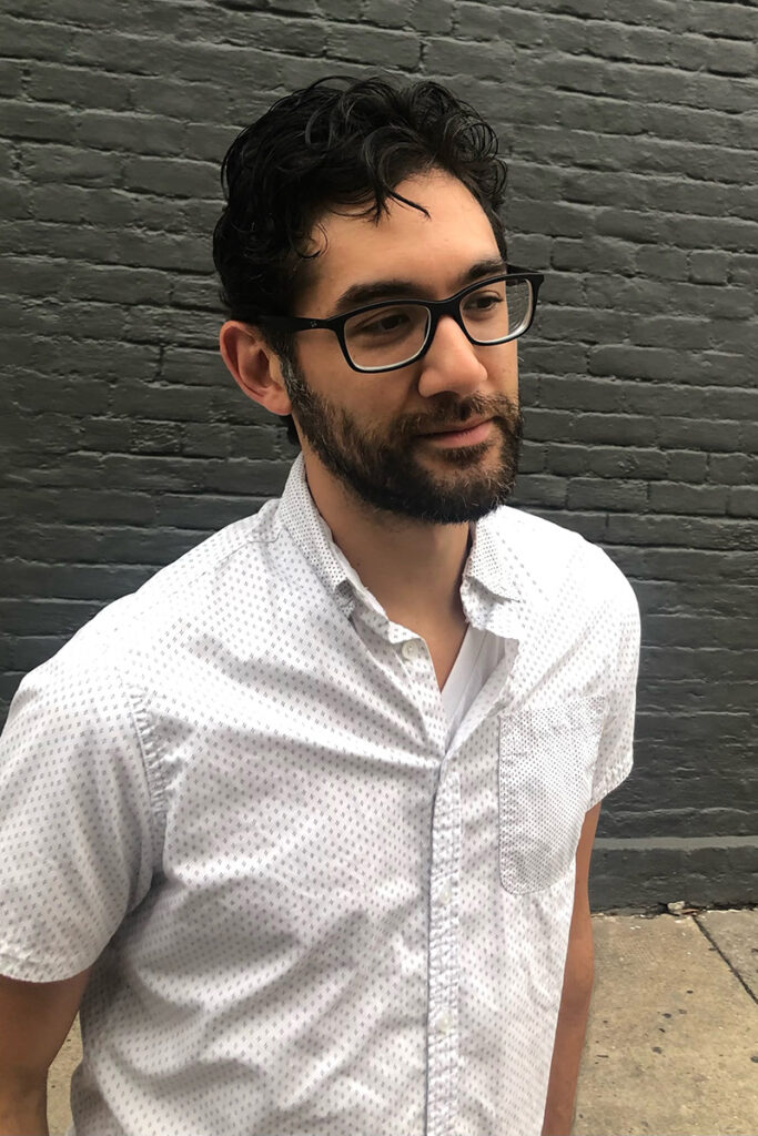 Man in white button down shirt, glasses