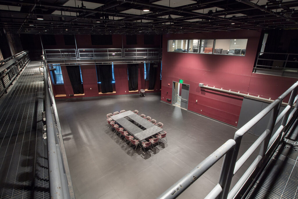 conference table on floor of black box theatre