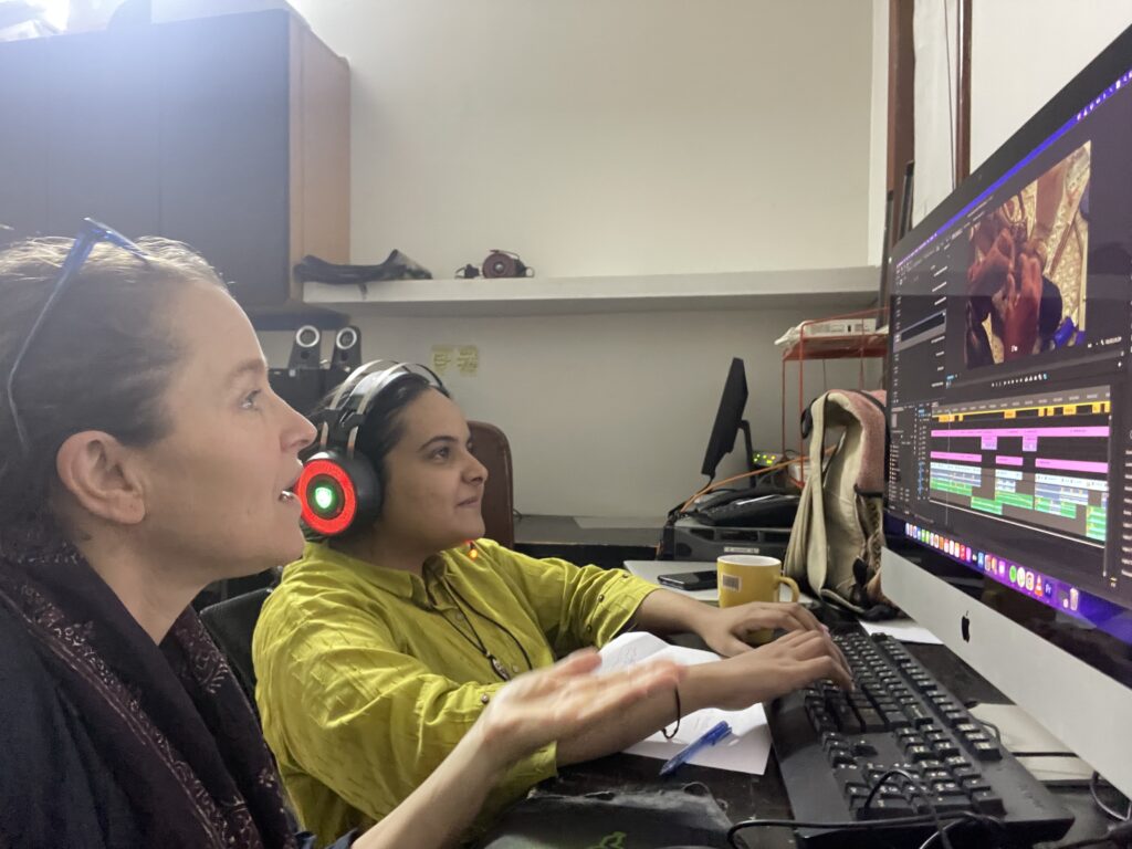 Jesse Epstein works on editing with a student