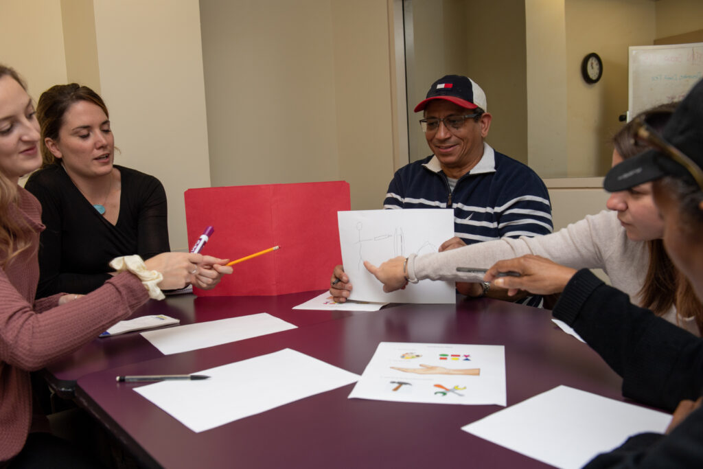 Two clinicians work with an adult client
