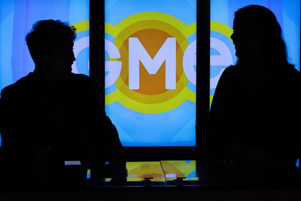 Silhouettes of the two co-hosts of Good Morning Emerson