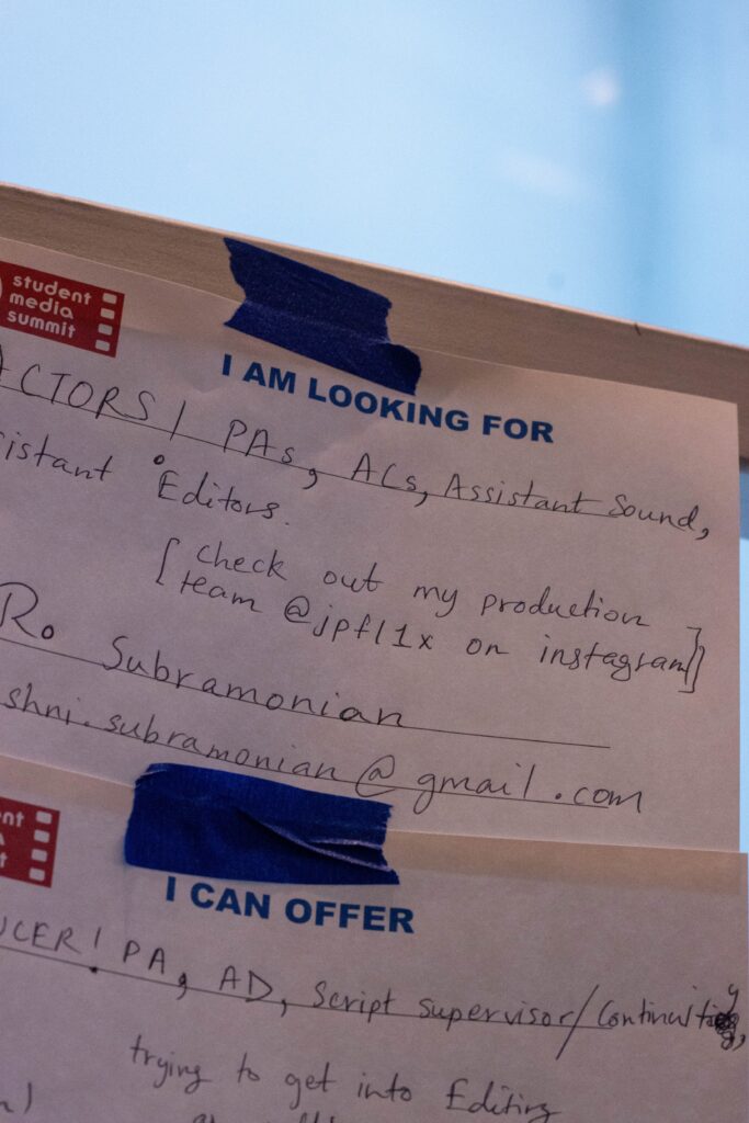 Student filmmakers put cue cards on the wall advertising what help they were looking for