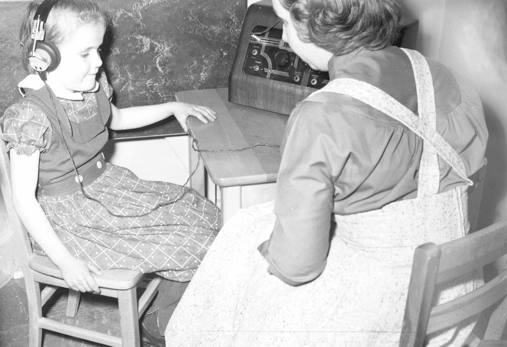 A clinician tests a young girl