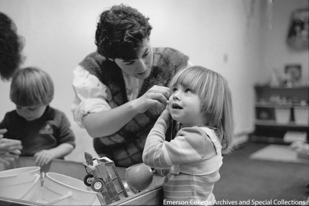 A clinician looks into a child's ear