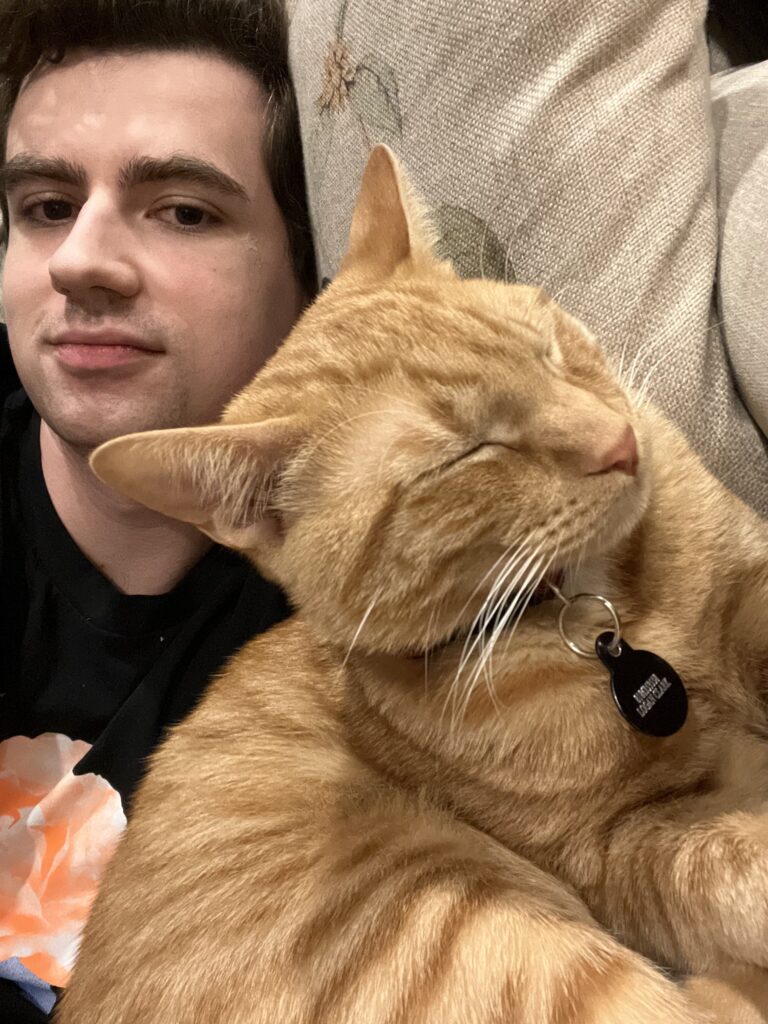 Logan Clark with his cat Walnut