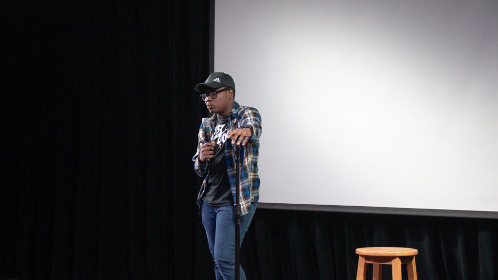 A person performs stand up