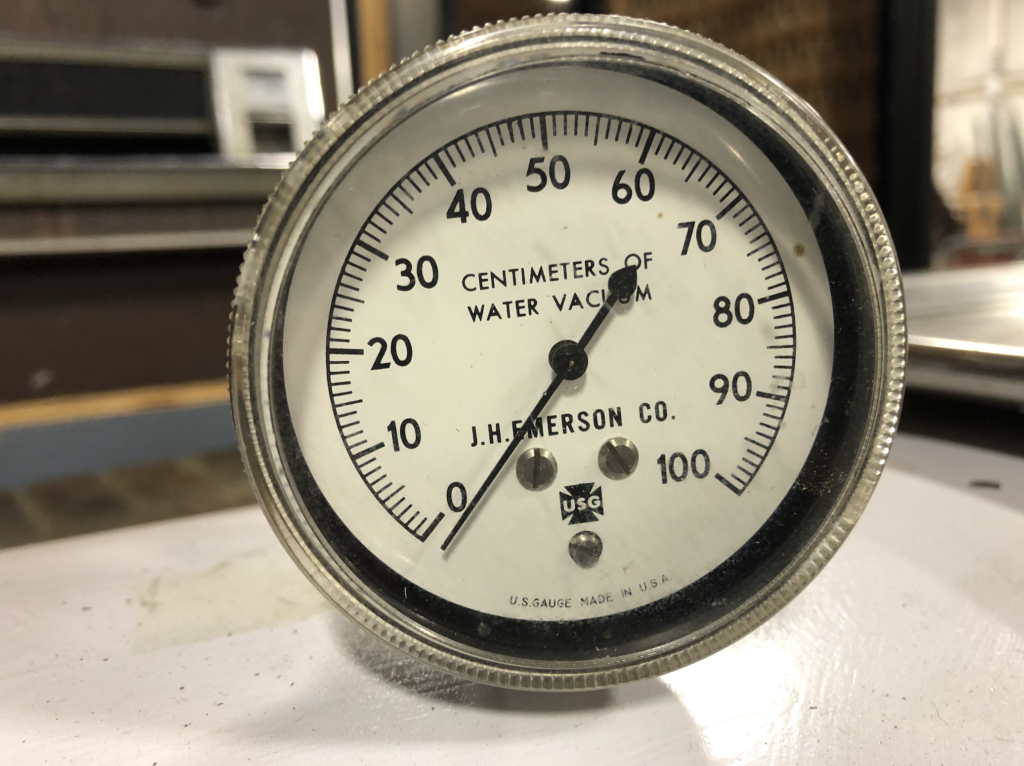 a gauge on the iron lung includes J.H. Emerson's name