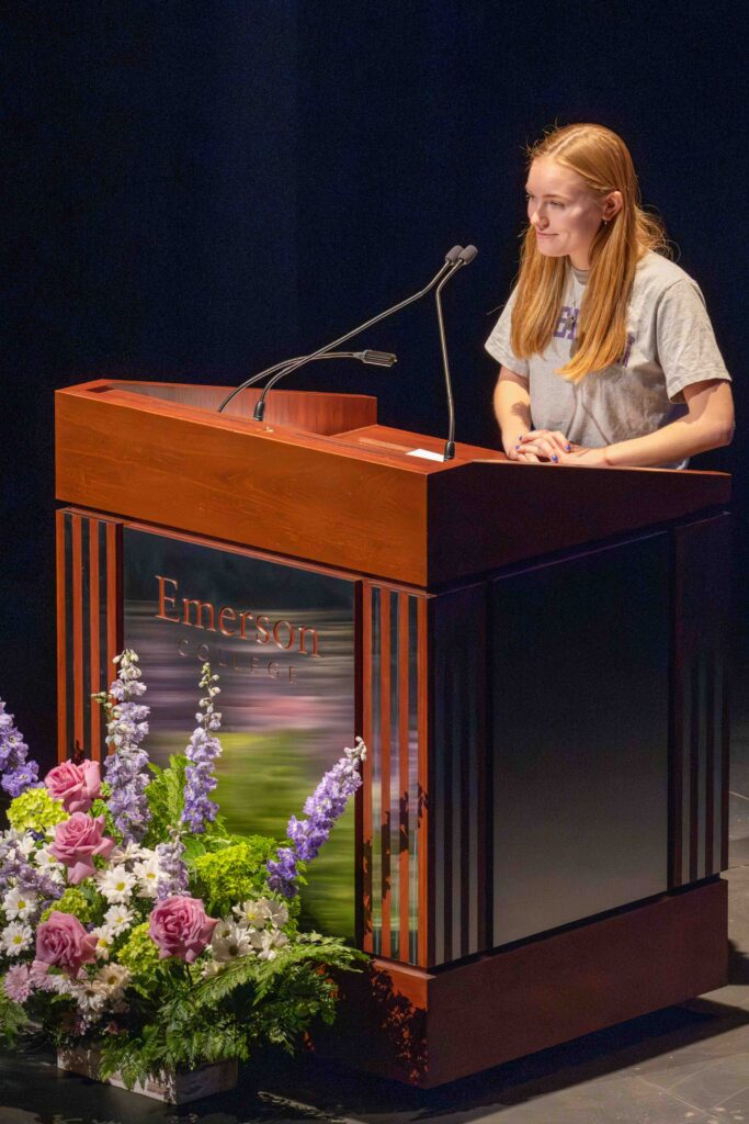 A woman speaks at a lectern