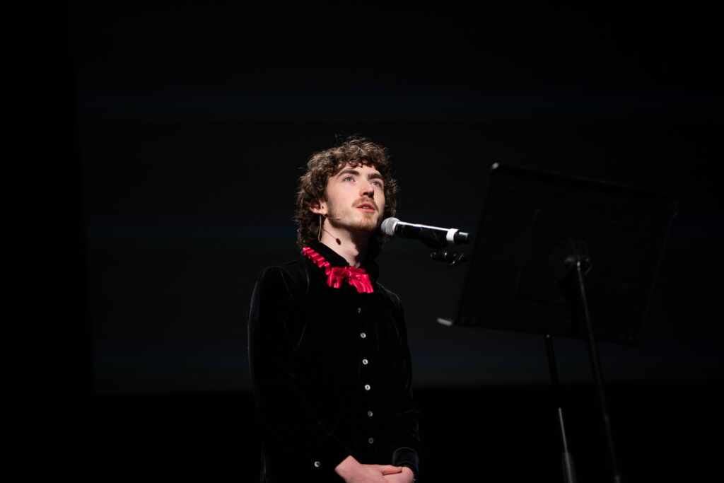 A person performs as Edgar Allen Poe.