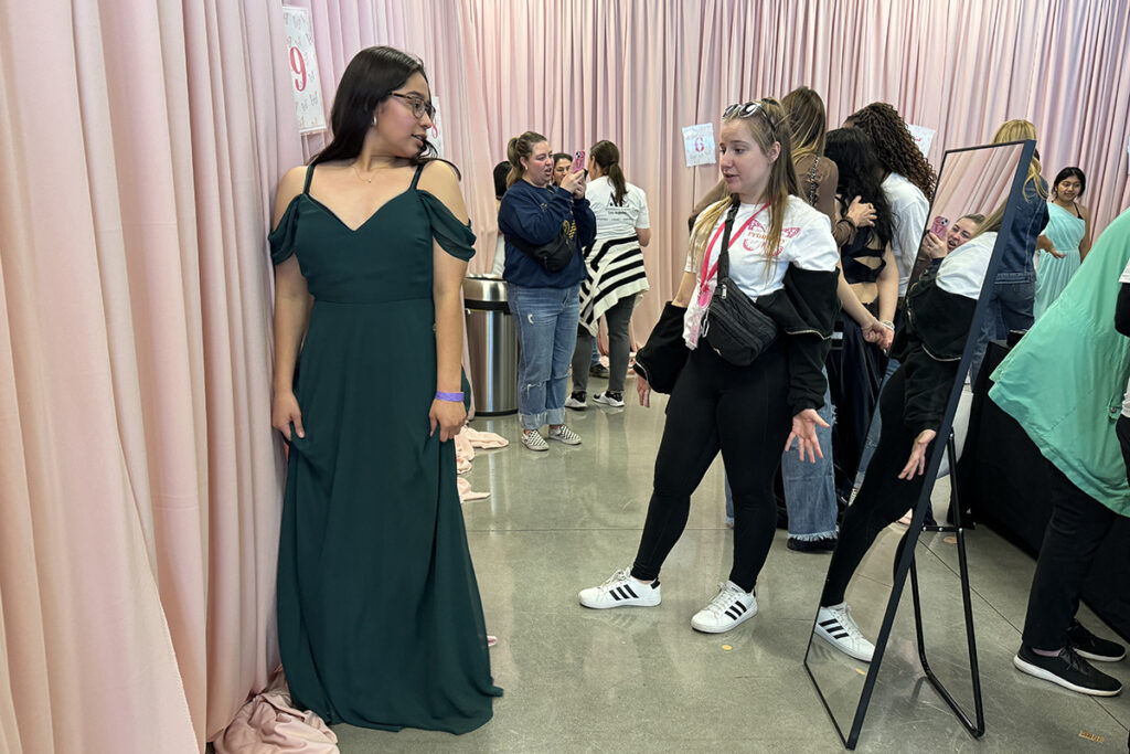Andrea tries on a gown