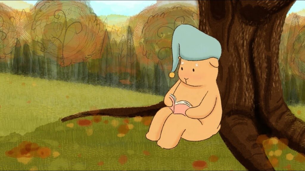 A cartoon image of an animal sitting against a tree with a sleep cap on their head while they read a book