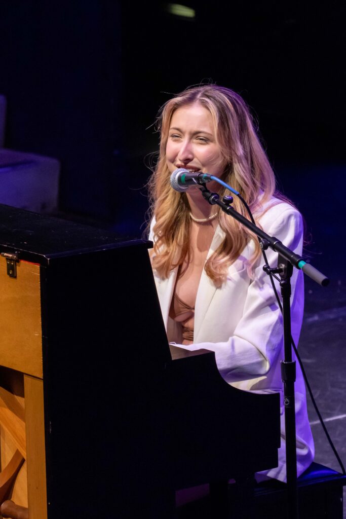 Jamie Elder performs on the piano