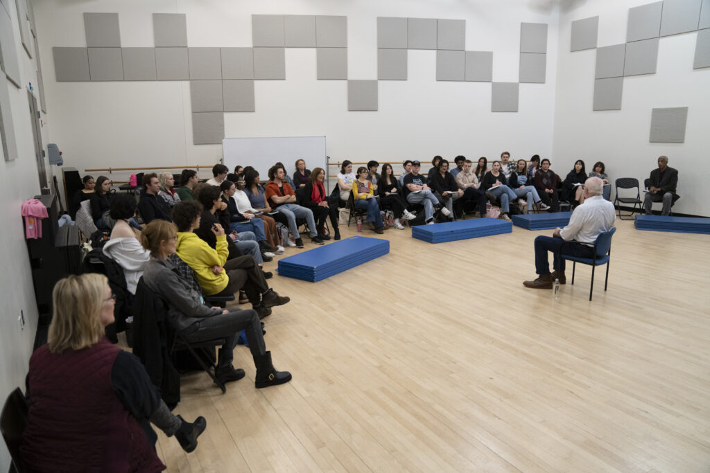 About three dozen students sit and listen to David Morse speak