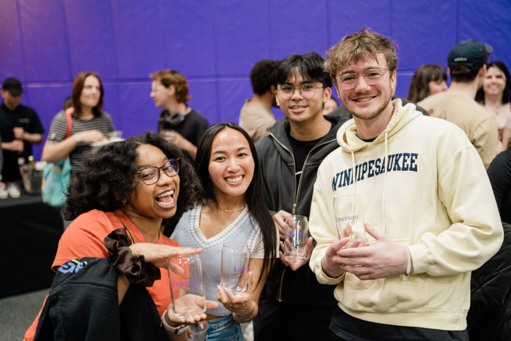 Four people pose for the camera