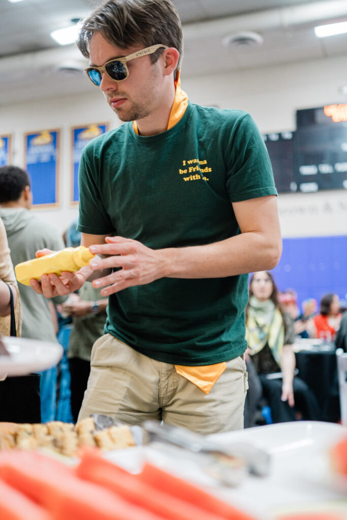 One person gathers food from the buffet