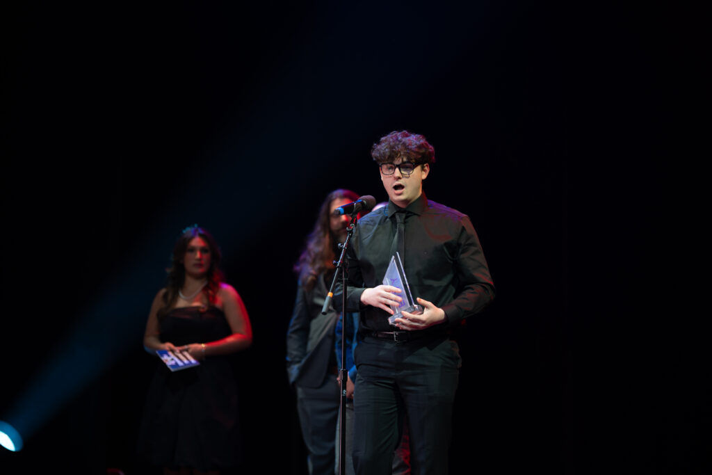 A person accepts an award