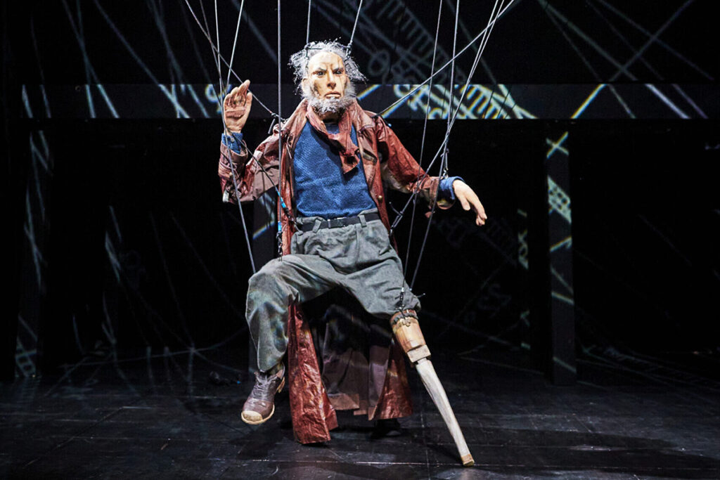 marionette of a bearded man with a peg leg
