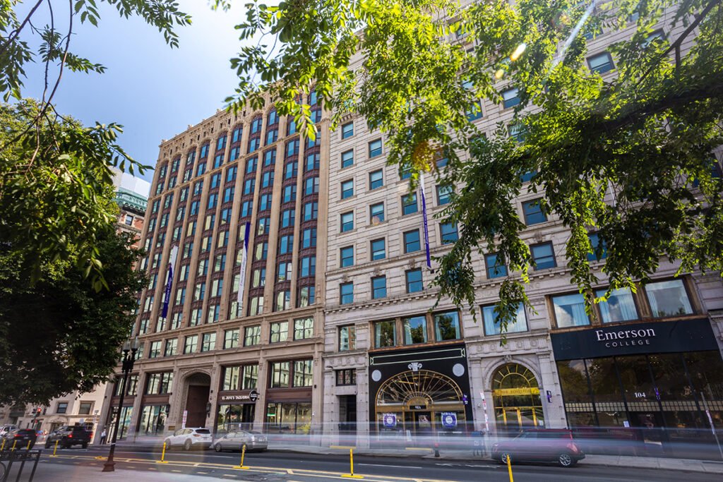Emerson buildings along Boylston Street, with cars zooming by
