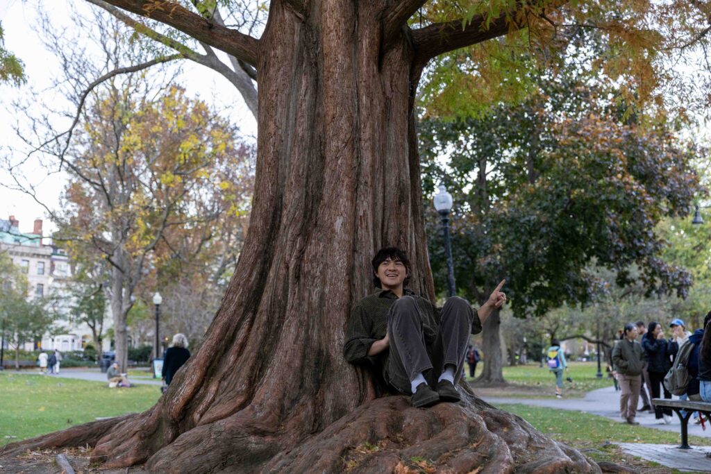 Christian Jones sits on tree