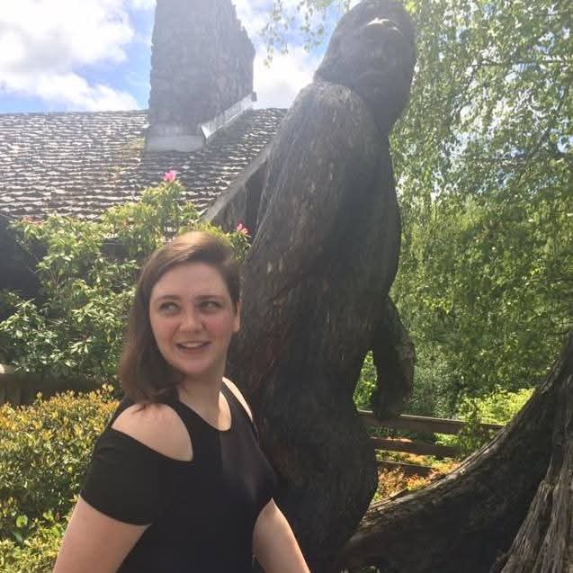 Madison Mondeaux in front of a bigfoot statue