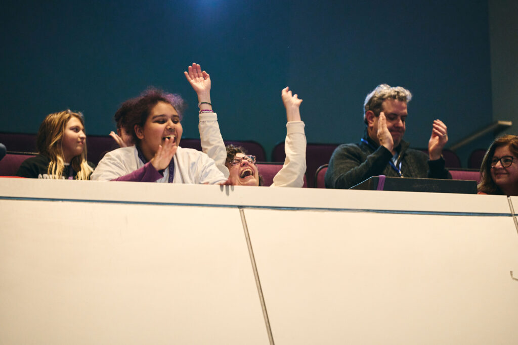 People in the balcony are excited