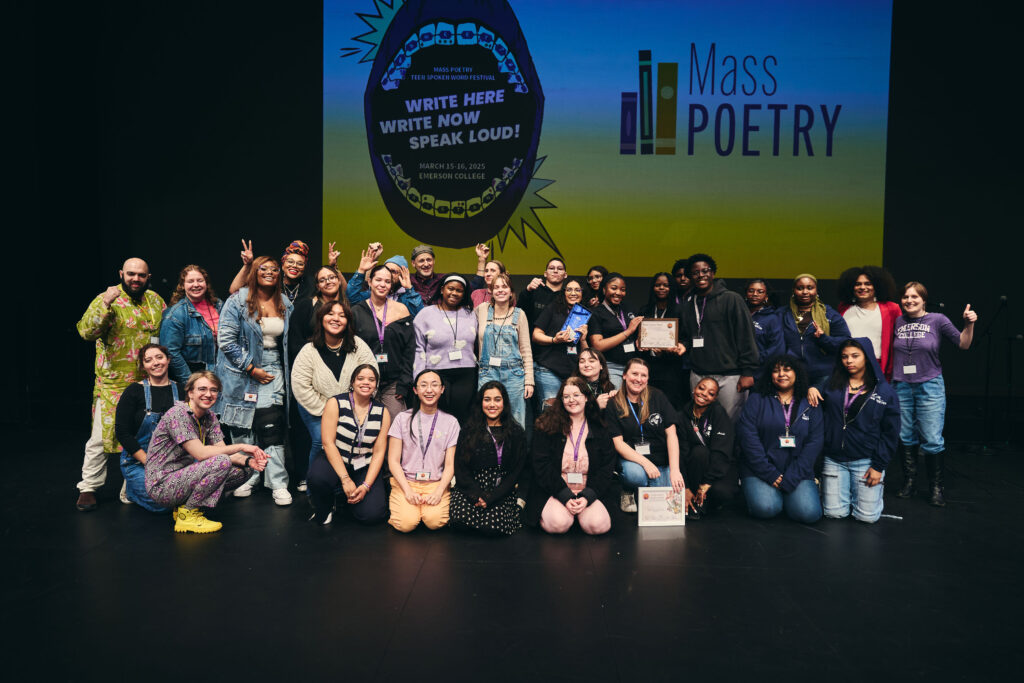 Participants of the Mass Poetry Teen Spoken Word Festival pose for a group photo on stage