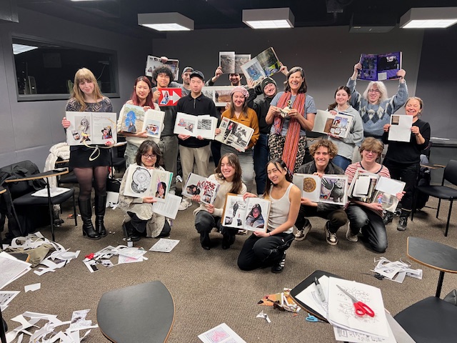 Students hold up the collages they made