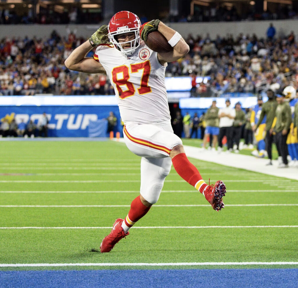 Kansas Chiefs tight end Travis Kelce struts into the end zone while scoring a touchdown