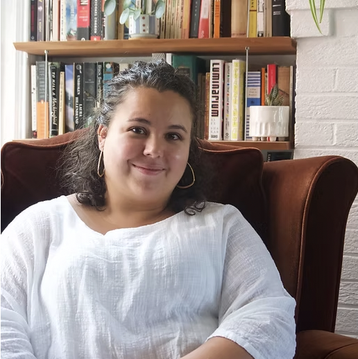 Larissa Melo Pienkowski sitting in a chair