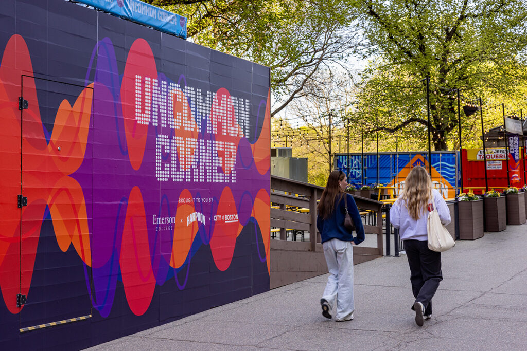 wall wrapped in purple, red, and orange, reading UnCommon corner
