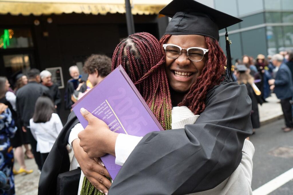 A person embraces another person.