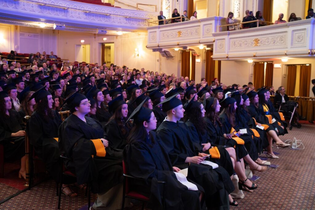 A sea of graduates sitting