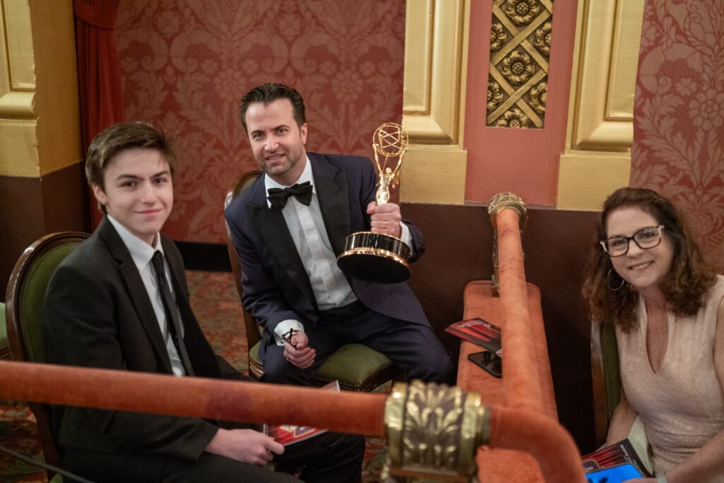 People posing with award