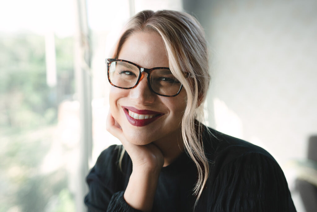 Woman with blonde hair, glasses