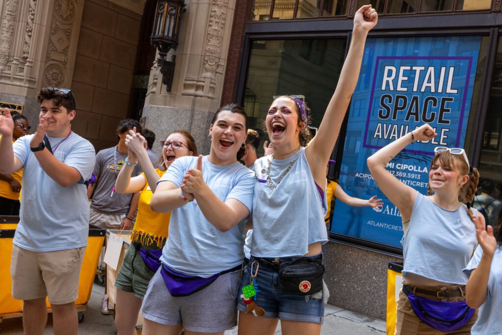 Two orientation leaders cheering.