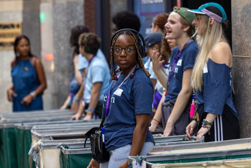 Orientation leaders lined up with carts