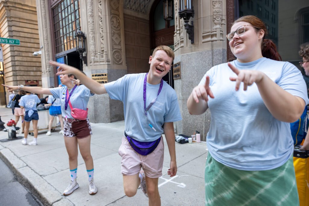 Orientation leaders dancing together.